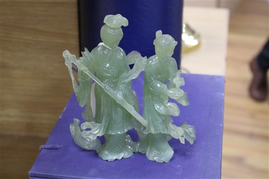 A 20th century Chinese carved bowenite jade figure of a courtesan and a similar group of a noble couple,